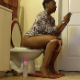 A black woman with short hair records herself farting repeatedly and pissing while sitting on a toilet. She talks about the foods she recently ate to make her fart so much. She may have pooped as well because she wipes her ass. Over 5 minutes.